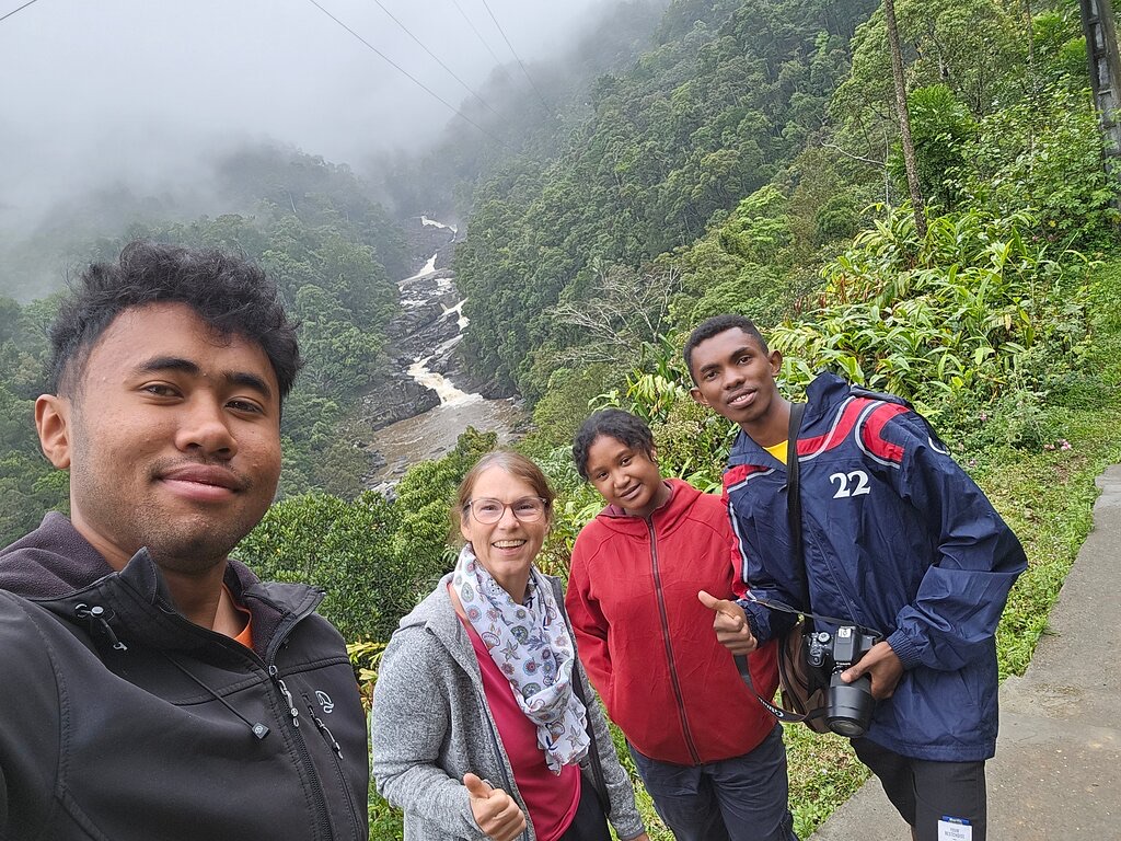 Brigitte and the team above a misty river valley